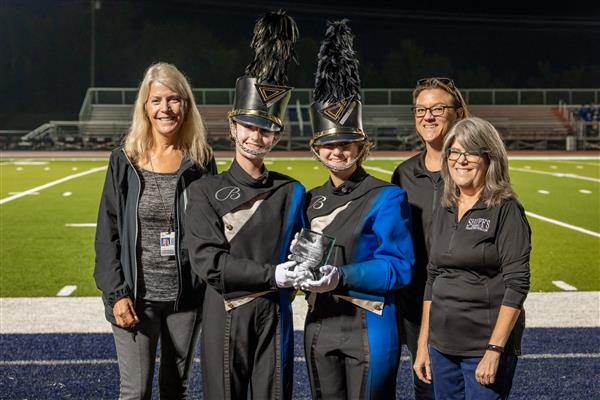 Brentwood High band members play on the football field